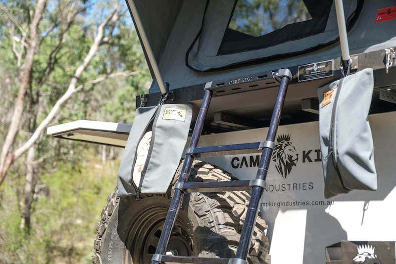 gray canvas shoe storage bag attached to roof top tent